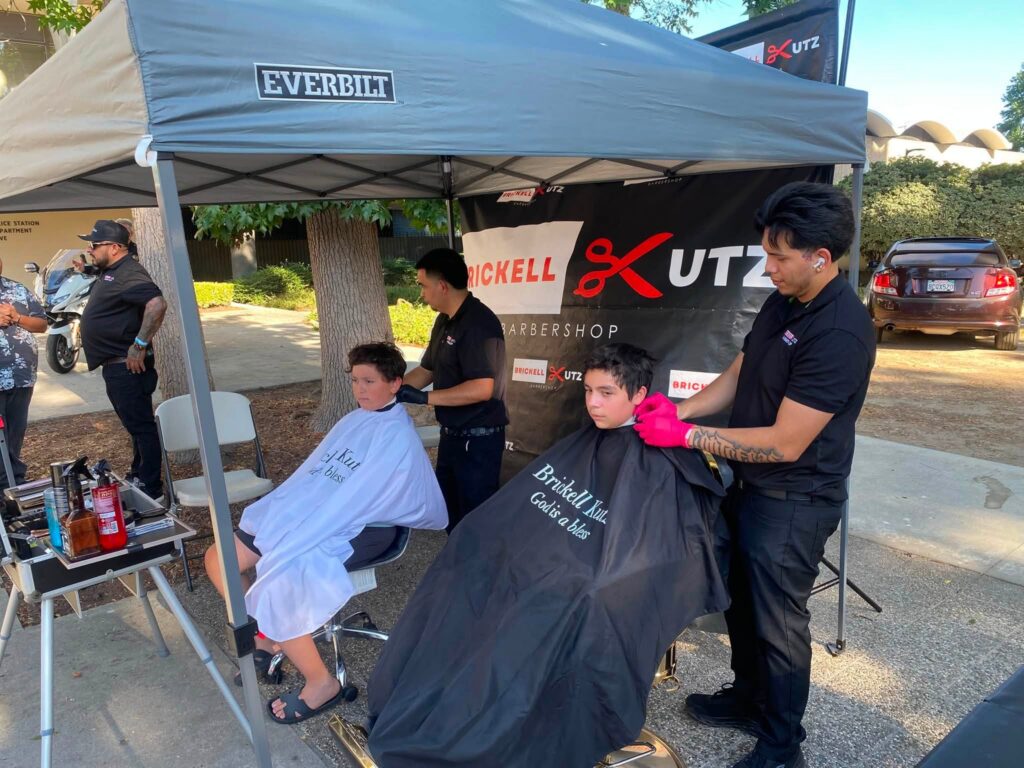 kids getting haircuts at national night out